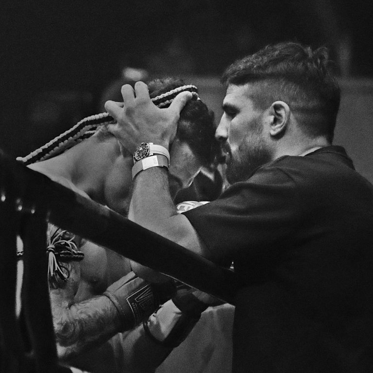 Mehdi Zatout removes a mongkol from his fighter at Rajadamnern Stadium